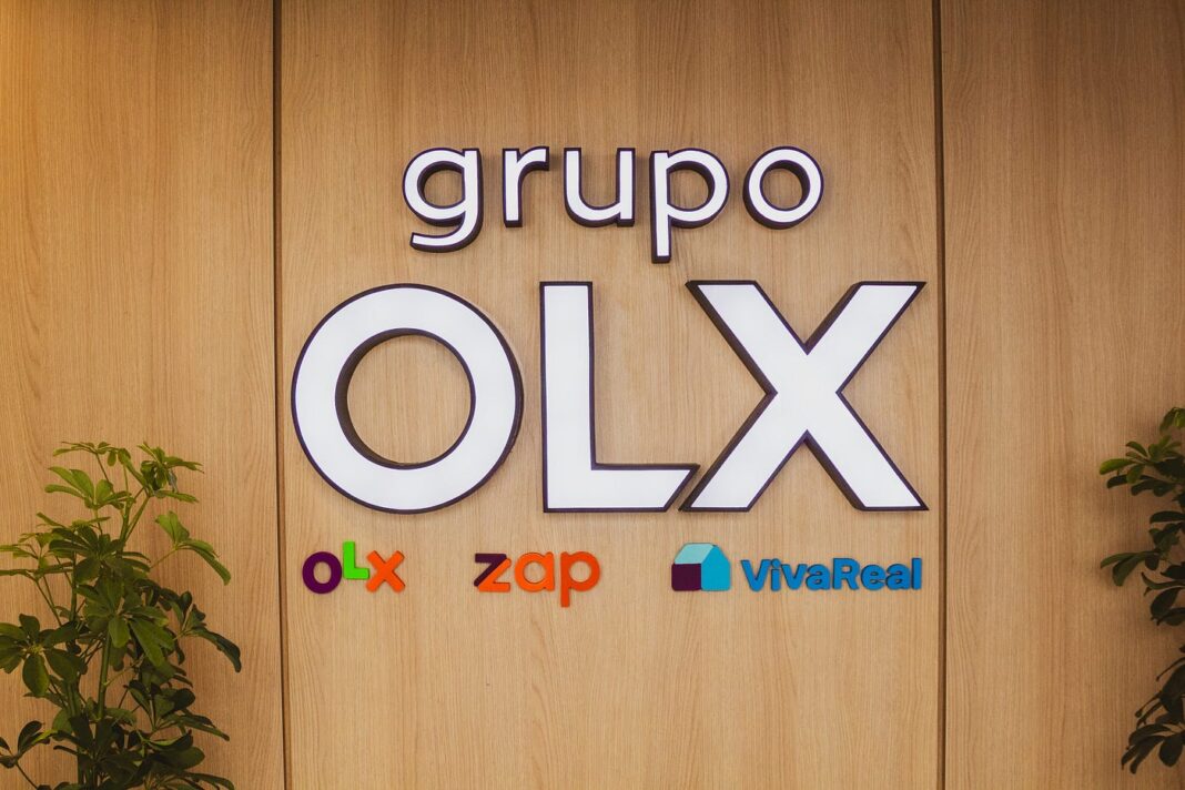 Placa na sede do grupo OLX